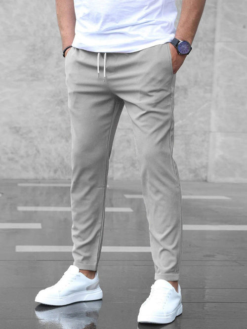 Pantalones casuales ajustados para hombre con cordón y bolsillos