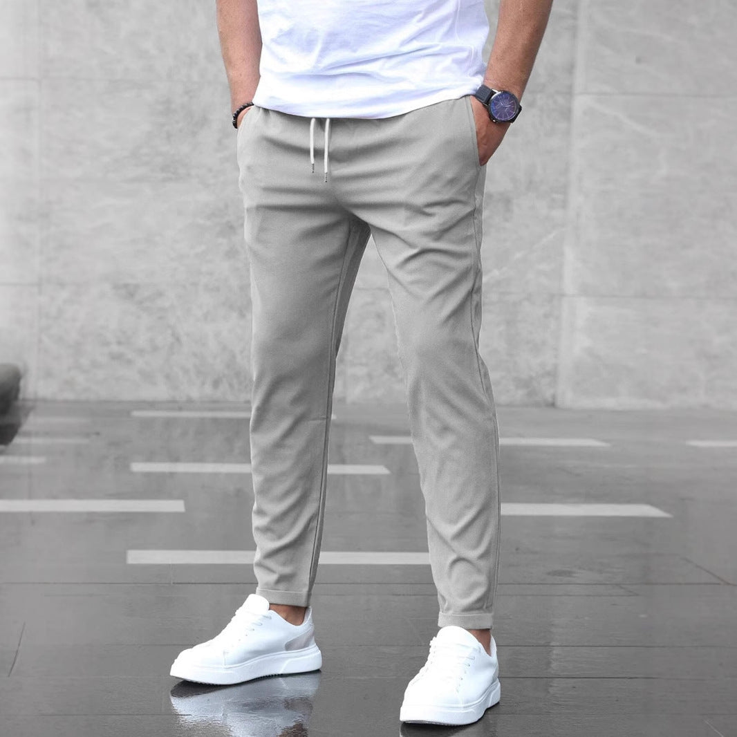 Pantalones casuales ajustados para hombre con cordón y bolsillos